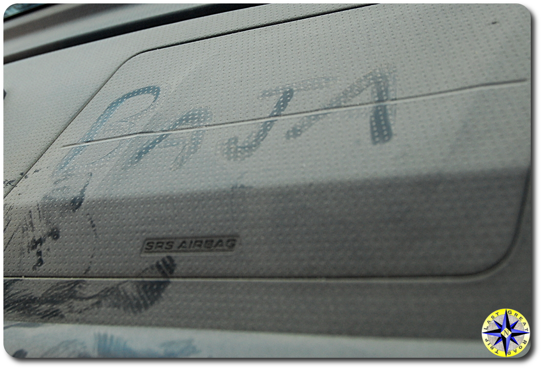 baja writen in dust on fj cruiser dash